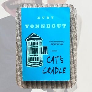 “Cat’s Cradle” by Kurt Vonnegut dark humor satire paperback novel